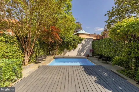 a bedroom with bed and a night stand