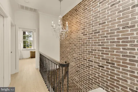 a large white room with a white table and chairs
