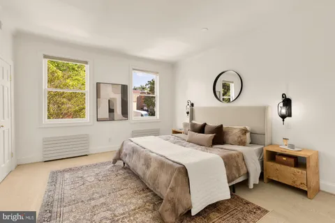 a view of a hallway with washer and dryer