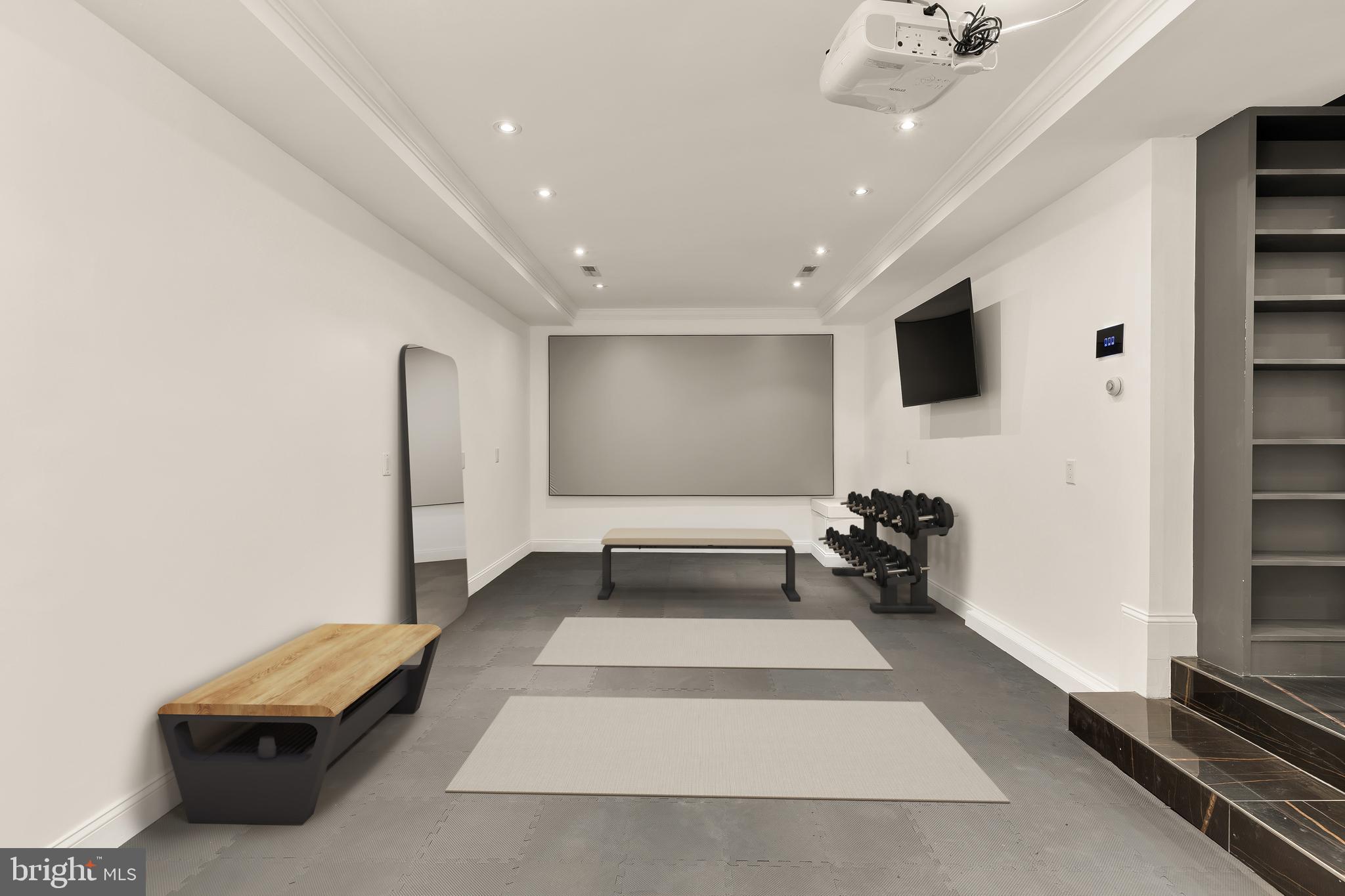 3249 P Street Northwest Washington, DC 20007 - Photo 55 of 63 a living room with furniture gym equipment and a flat screen tv