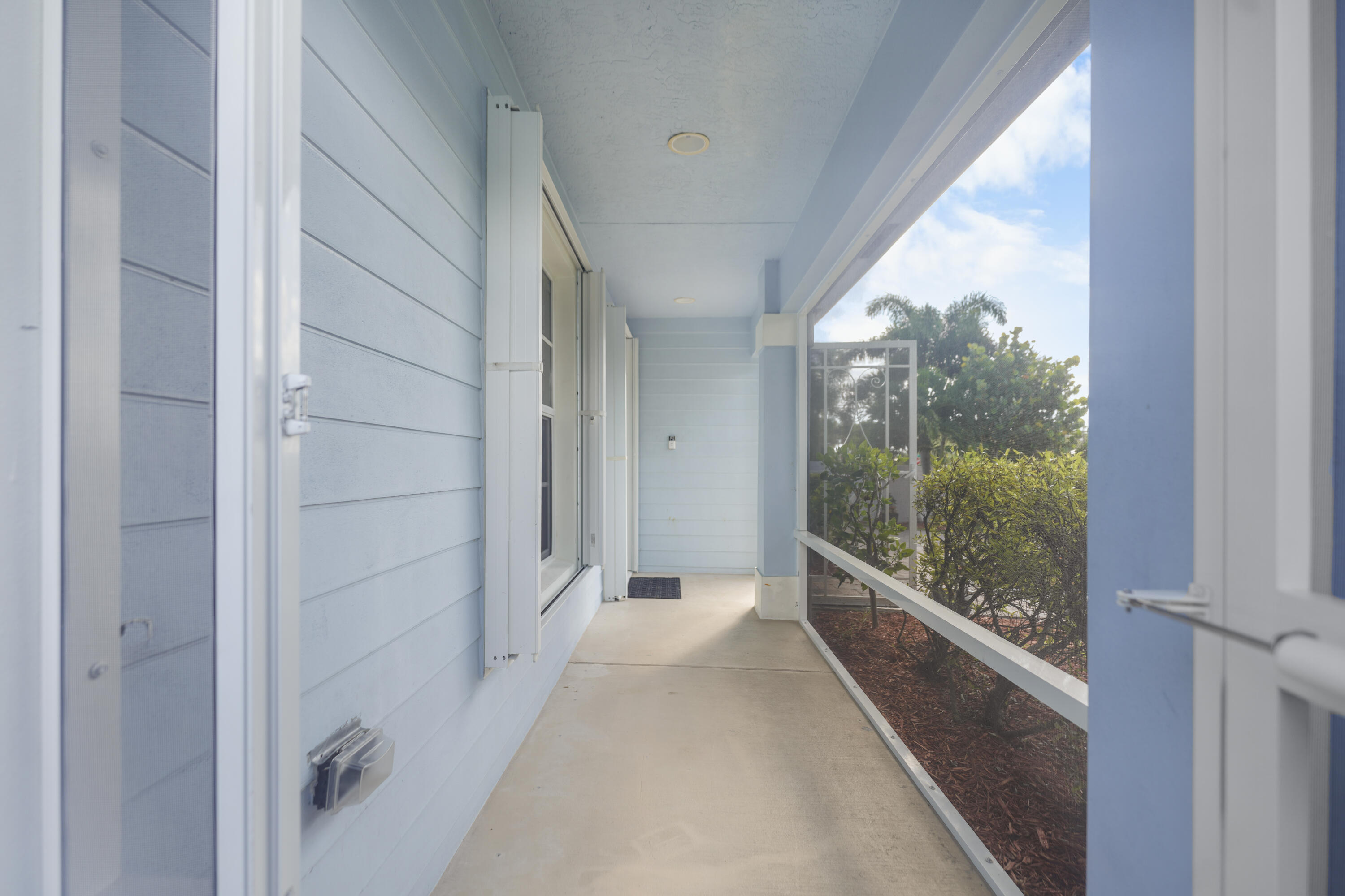 3199 Southeast Lime Tree Trail Stuart, FL 34997 - Photo 5 of 34 a view of a glass door and the balcony