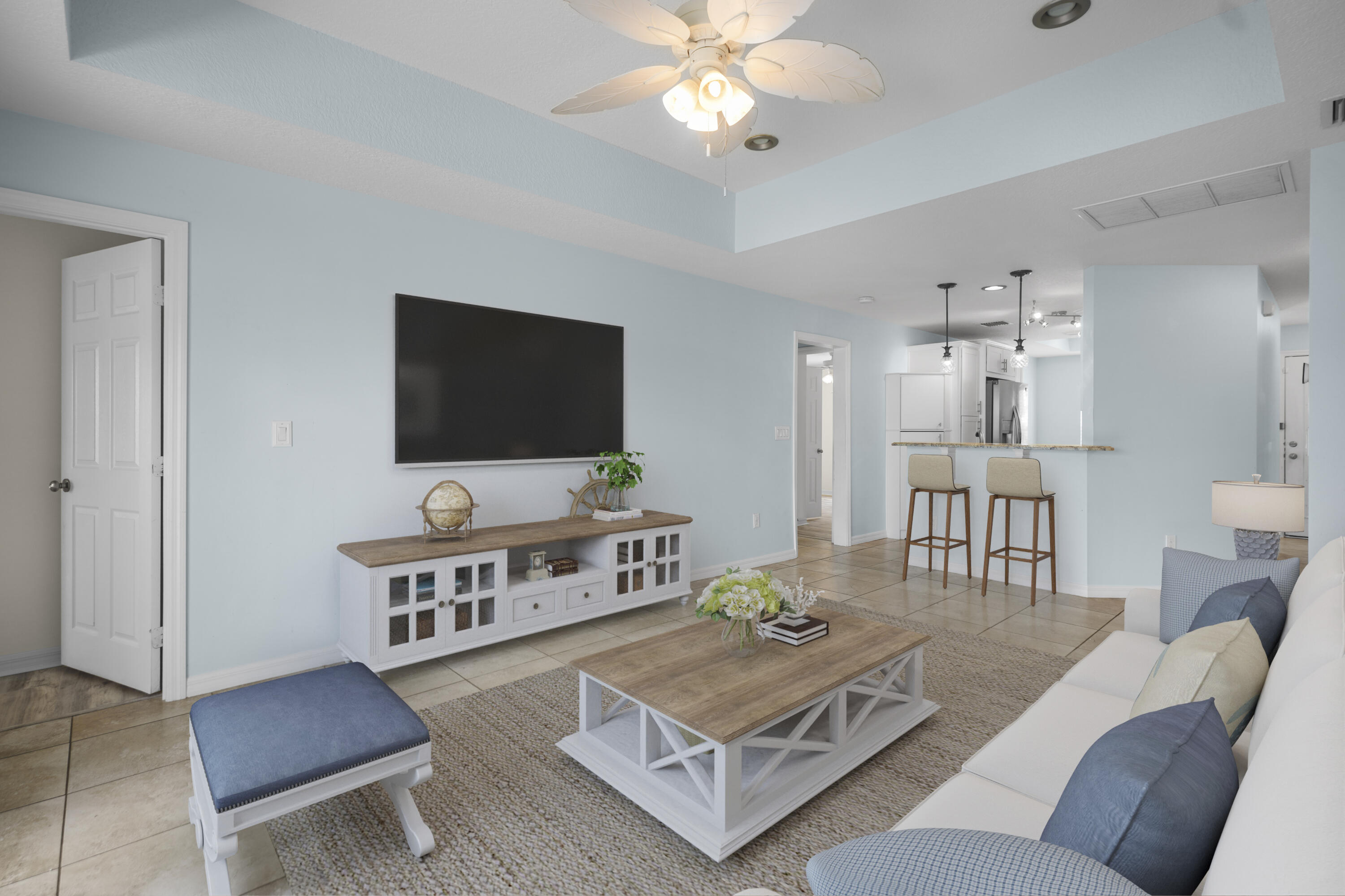 3199 Southeast Lime Tree Trail Stuart, FL 34997 - Photo 9 of 34 a living room with furniture and a flat screen tv