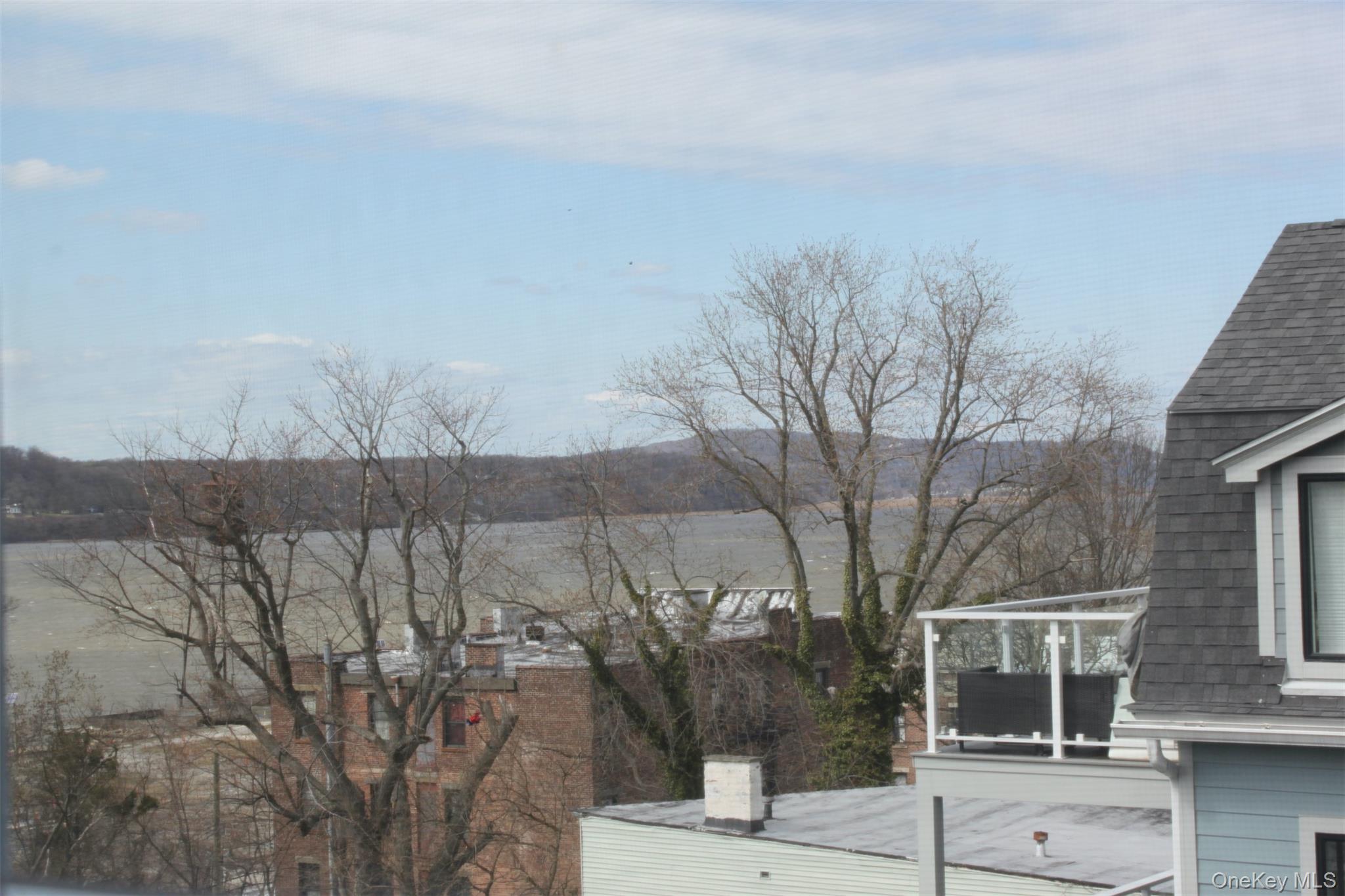 451 Warburton Avenue, Unit 3 Hastings-on-Hudson, NY 10706 - Photo 14 of 16 a view of a house with a yard