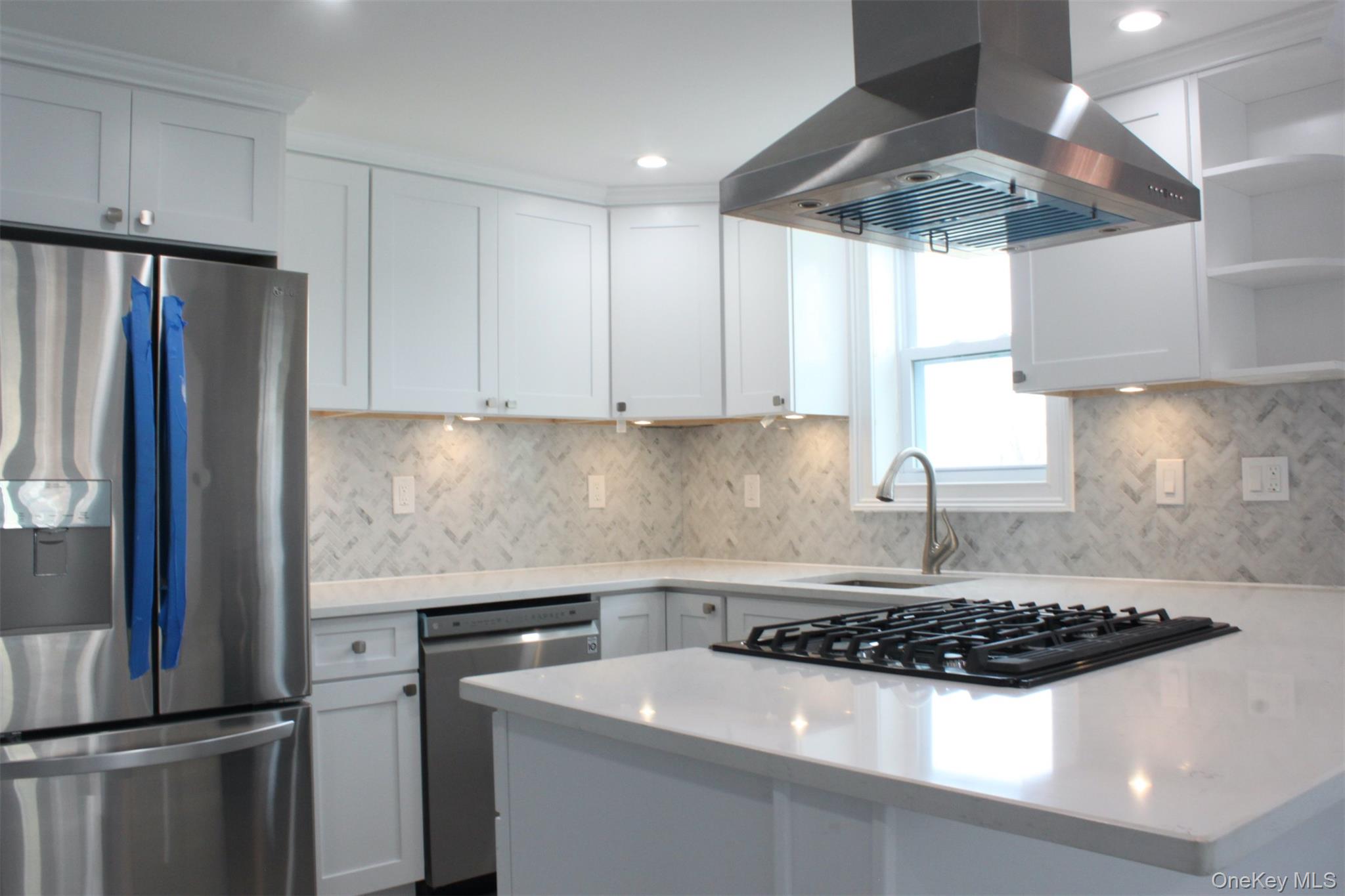 451 Warburton Avenue, Unit 3 Hastings-on-Hudson, NY 10706 - Photo 4 of 16 a kitchen with stainless steel appliances granite countertop a sink stove and refrigerator