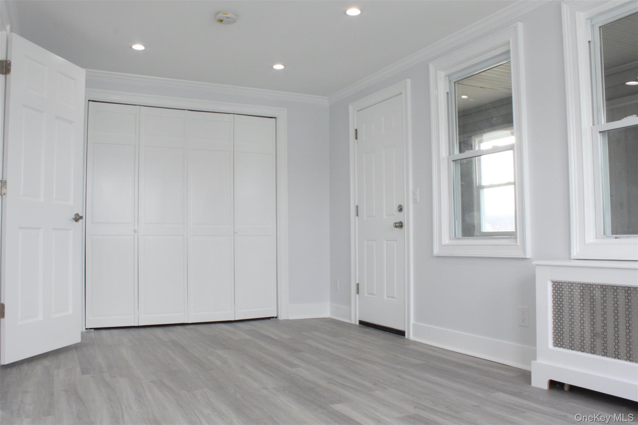 451 Warburton Avenue, Unit 3 Hastings-on-Hudson, NY 10706 - Photo 6 of 16 a view of an empty room with wooden floor and a window