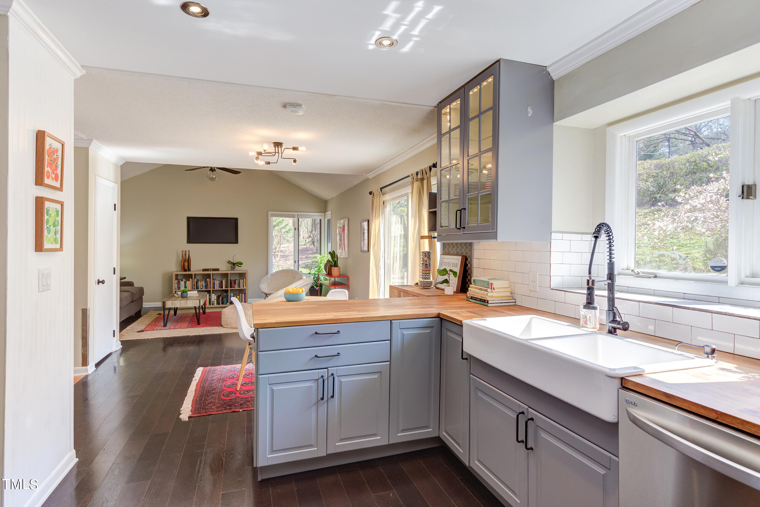 30 Sandstone Ridge Drive Durham, NC 27713 - Photo 20 of 65 a kitchen with granite countertop a sink stove and cabinets