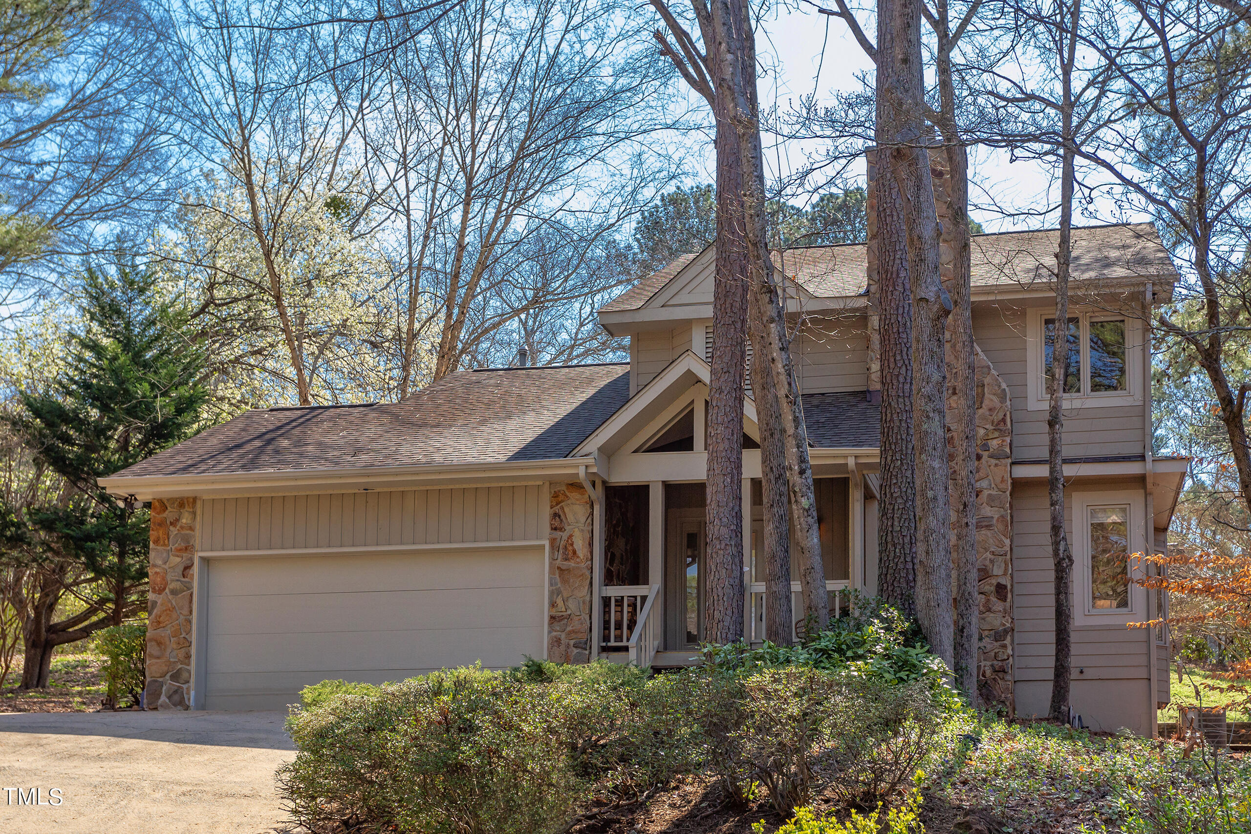 30 Sandstone Ridge Drive Durham, NC 27713 - Photo 2 of 65 a front view of a house with a garden