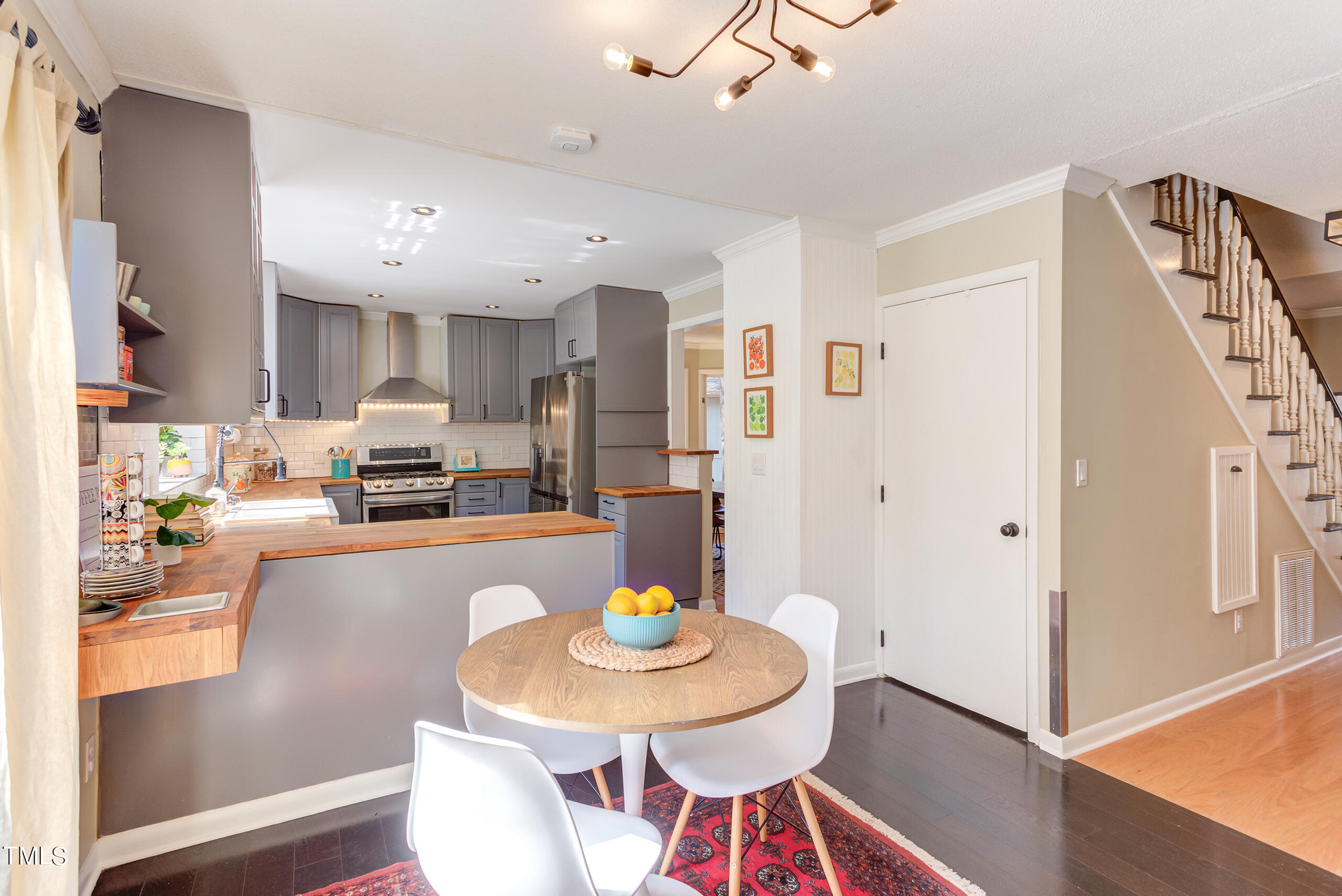 30 Sandstone Ridge Drive Durham, NC 27713 - Photo 25 of 65 a living room with stainless steel appliances furniture and a dining table