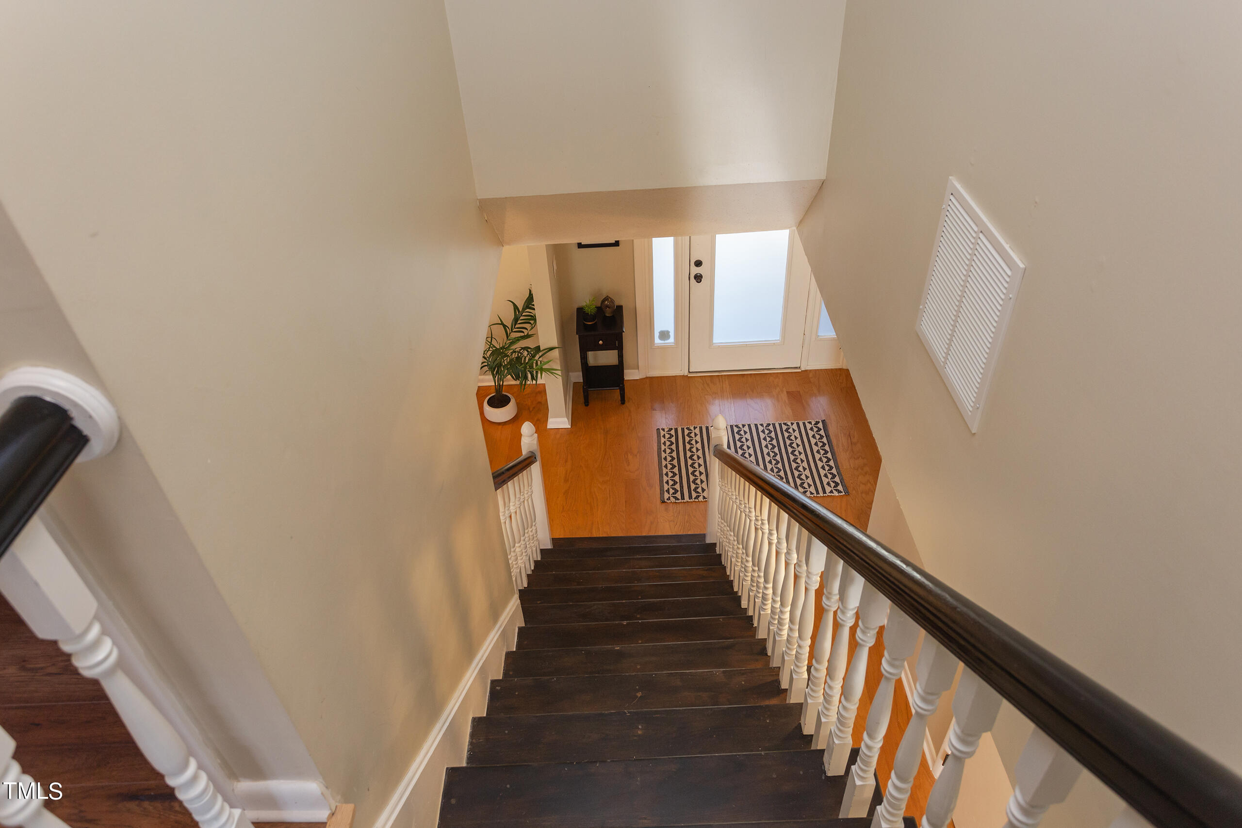30 Sandstone Ridge Drive Durham, NC 27713 - Photo 34 of 65 a view of a hallway with wooden floor and stairs