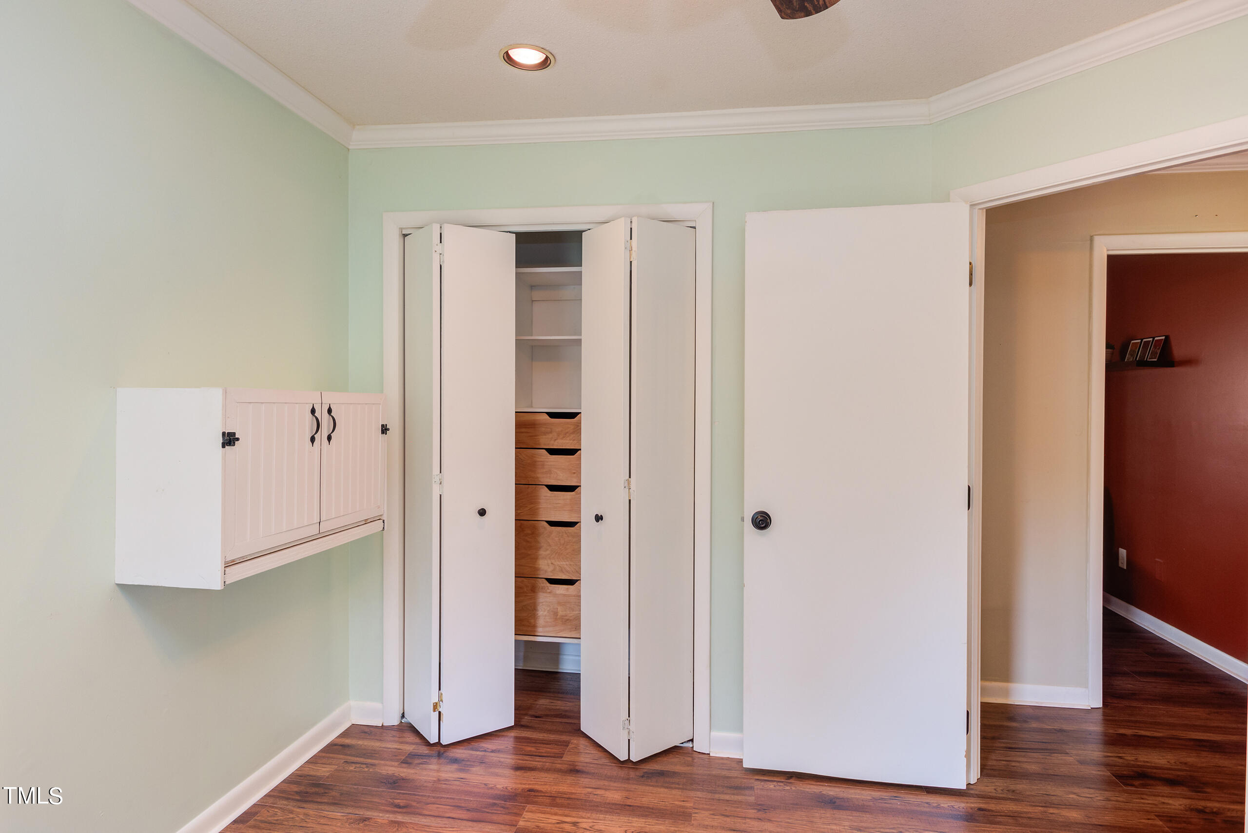 30 Sandstone Ridge Drive Durham, NC 27713 - Photo 45 of 65 a view of walk in closet with wooden floor