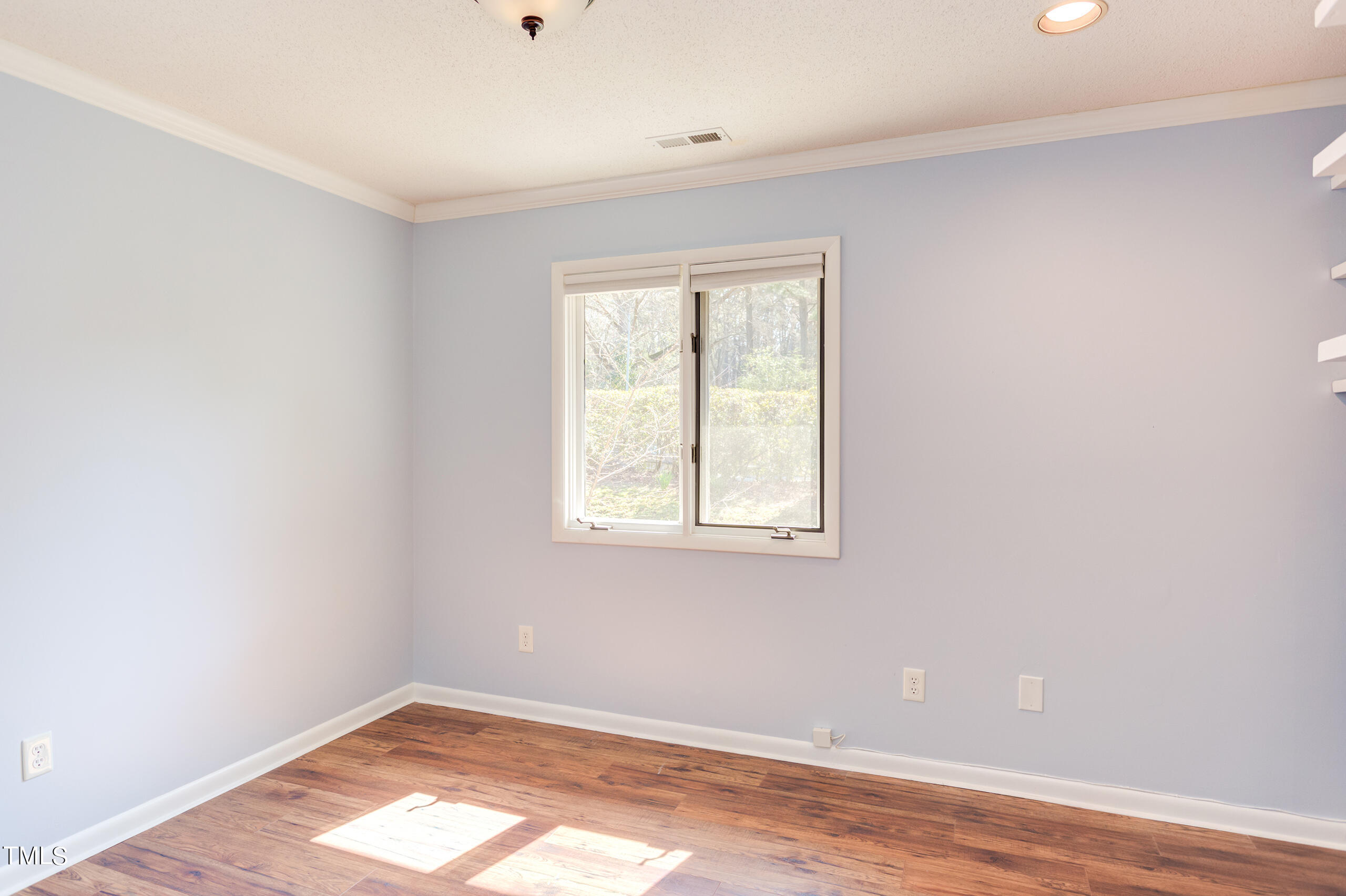 30 Sandstone Ridge Drive Durham, NC 27713 - Photo 46 of 65 an empty room with wooden floor and windows