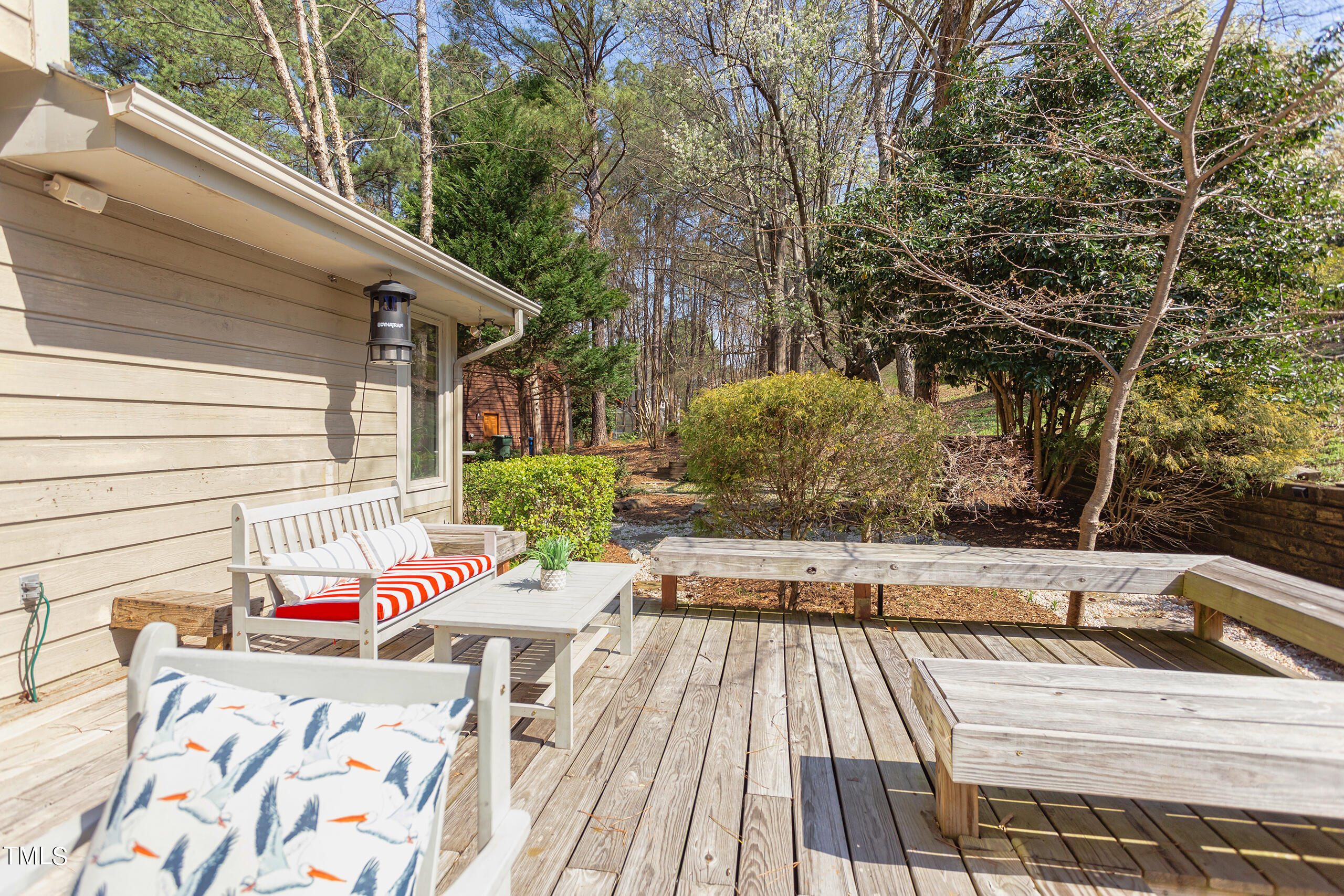 30 Sandstone Ridge Drive Durham, NC 27713 - Photo 56 of 65 a view of a patio with table and chairs with wooden floor and fence