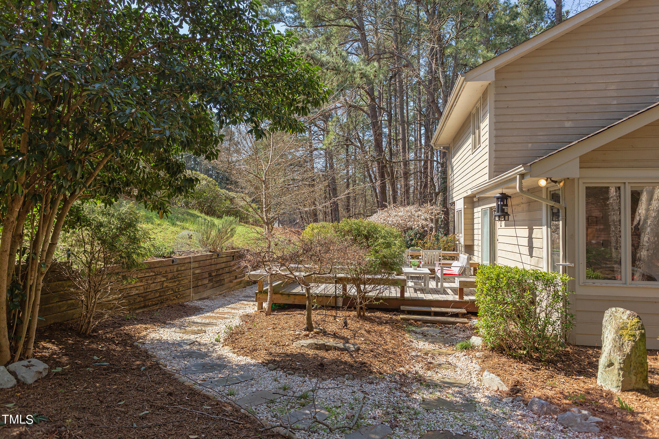 30 Sandstone Ridge Drive Durham, NC 27713 - Photo 59 of 65 a view of backyard with seating space and trees