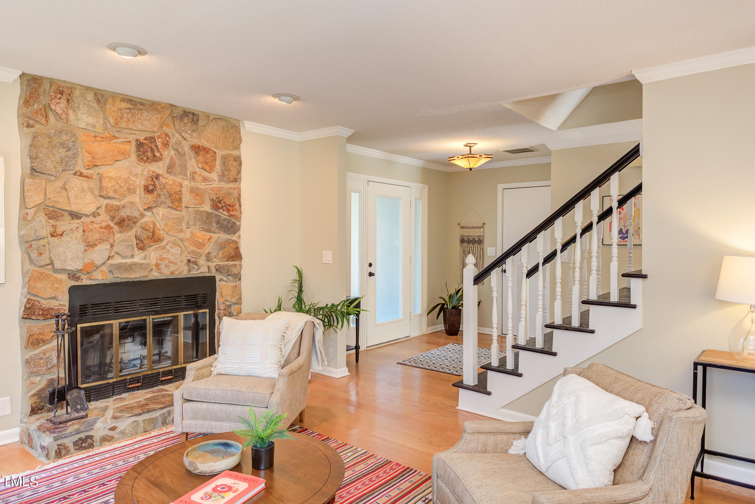 30 Sandstone Ridge Drive Durham, NC 27713 - Photo 9 of 65 a living room with furniture a fireplace and a flat screen tv