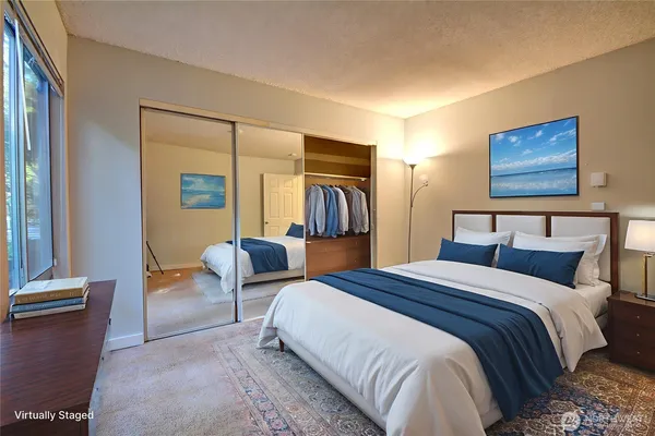 a bedroom with bed and window