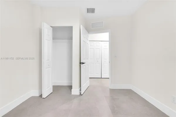 a kitchen with a sink and a refrigerator