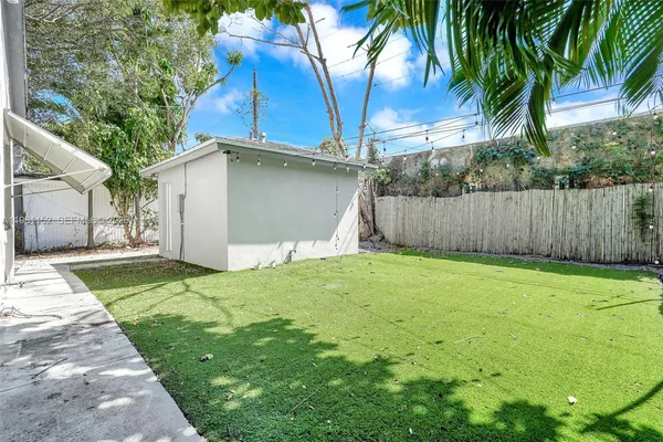 a house with trees in the background