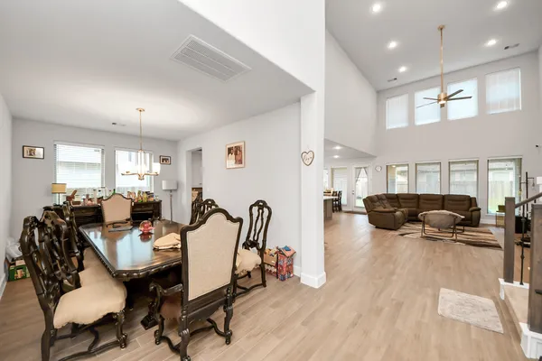 a view of a dining room with furniture window and wooden floor