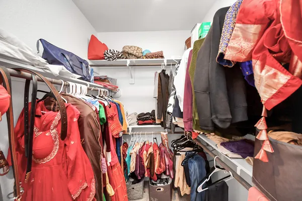 a view of a livingroom with wooden floor and stairs