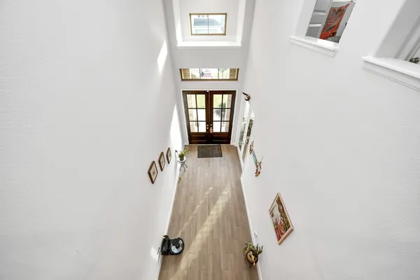 a bedroom with furniture and a wooden floor