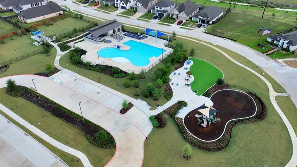 an aerial view of a swimming pool and outdoor space