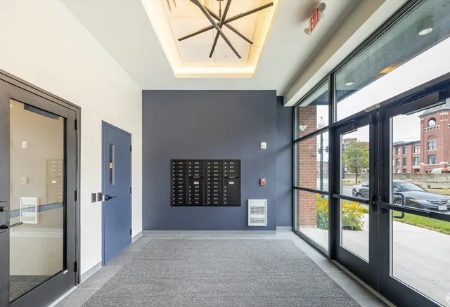 a view of an entryway with a floor to ceiling window