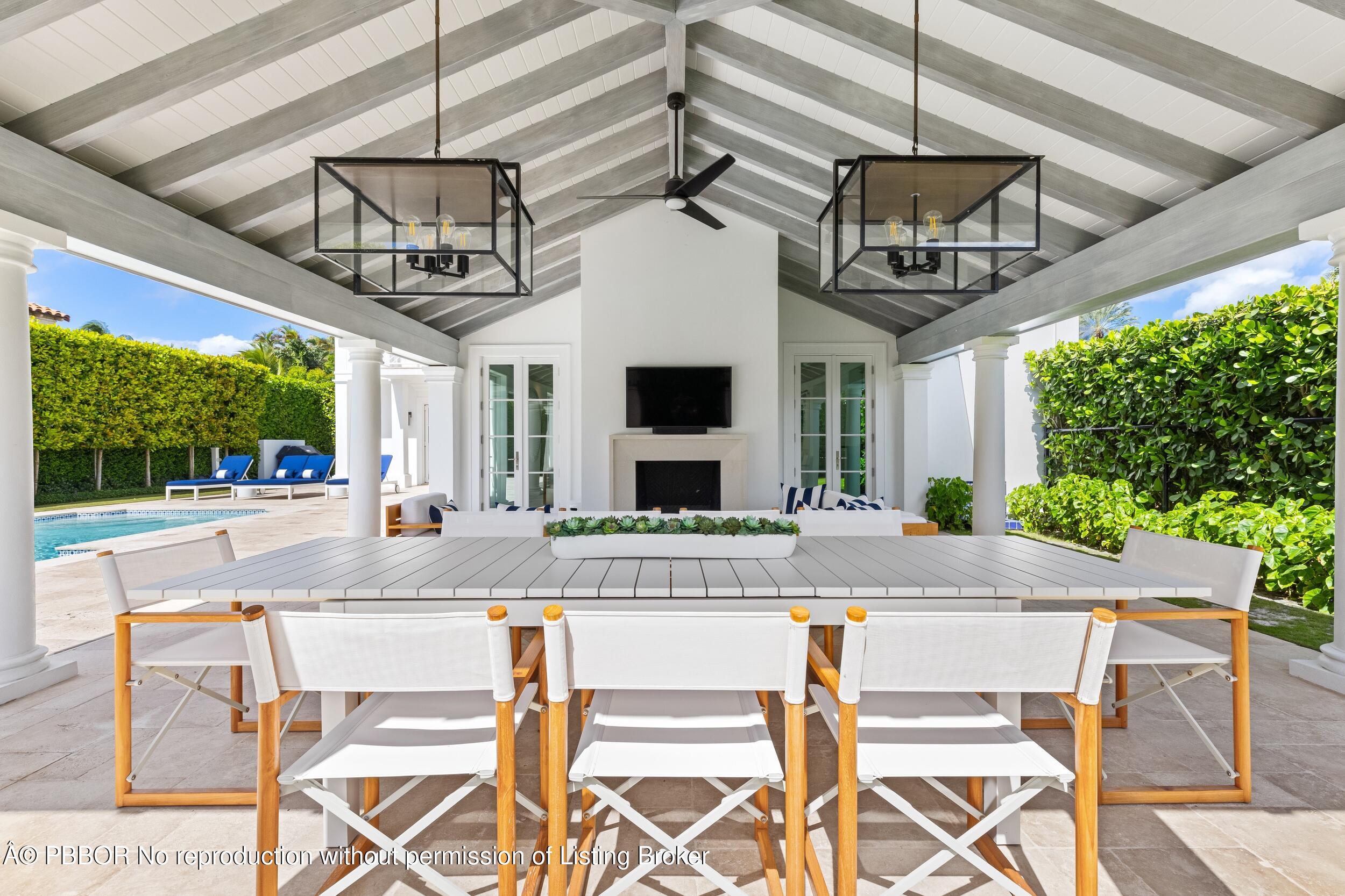 201 Banyan Road Palm Beach, FL 33480 - Photo 30 of 42 a view of a dining room with furniture wooden floor and chandelier