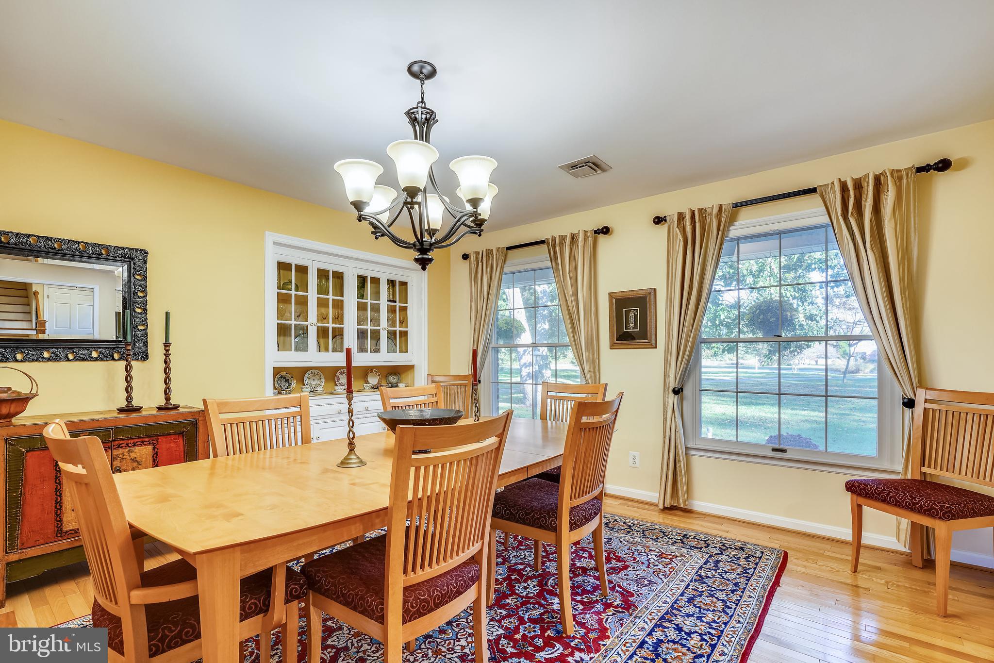 2520 Bennett Point Road Queenstown, MD 21658 - Photo 22 of 51 Chandeliered Dining Room . Oversized Windows