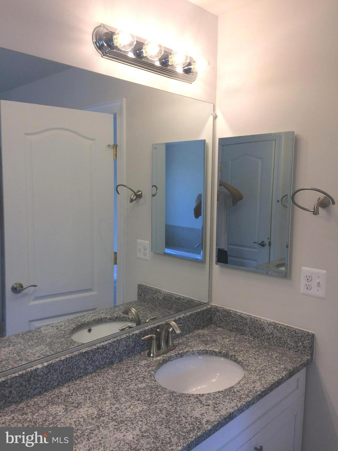 6510 Lawyers Hill Road Elkridge, MD 21075 - Photo 20 of 28 a bathroom with a sink and a mirror
