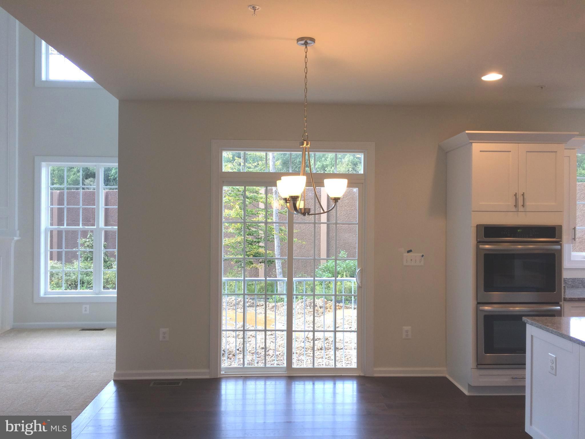 6510 Lawyers Hill Road Elkridge, MD 21075 - Photo 4 of 28 a view of a kitchen with a dishwasher cabinets and a wooden floor