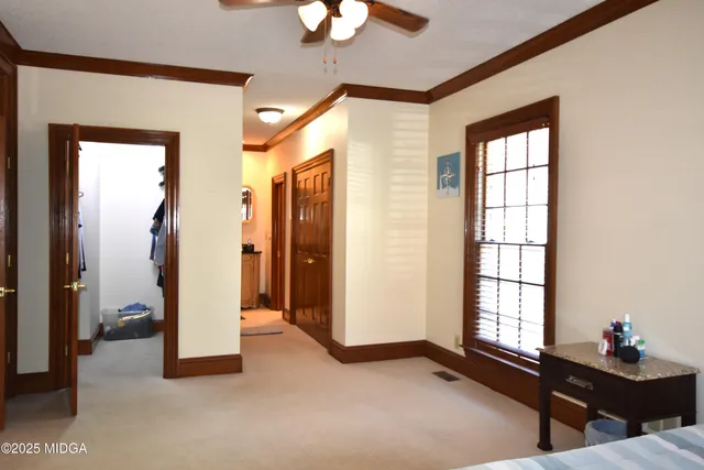 a workspace with a window and a livingroom