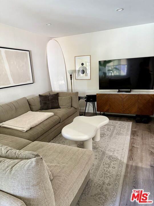 27 Anchorage Street, Unit B Marina del Rey, CA 90292 - Photo 9 of 15 a living room with furniture and a flat screen tv