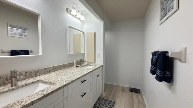 a bathroom with a sink and mirror