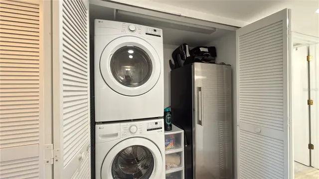 a view of a hallway with washer and dryer