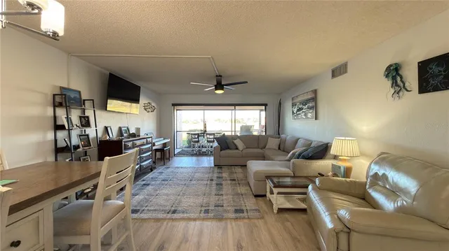 a living room with furniture and flat screen tv