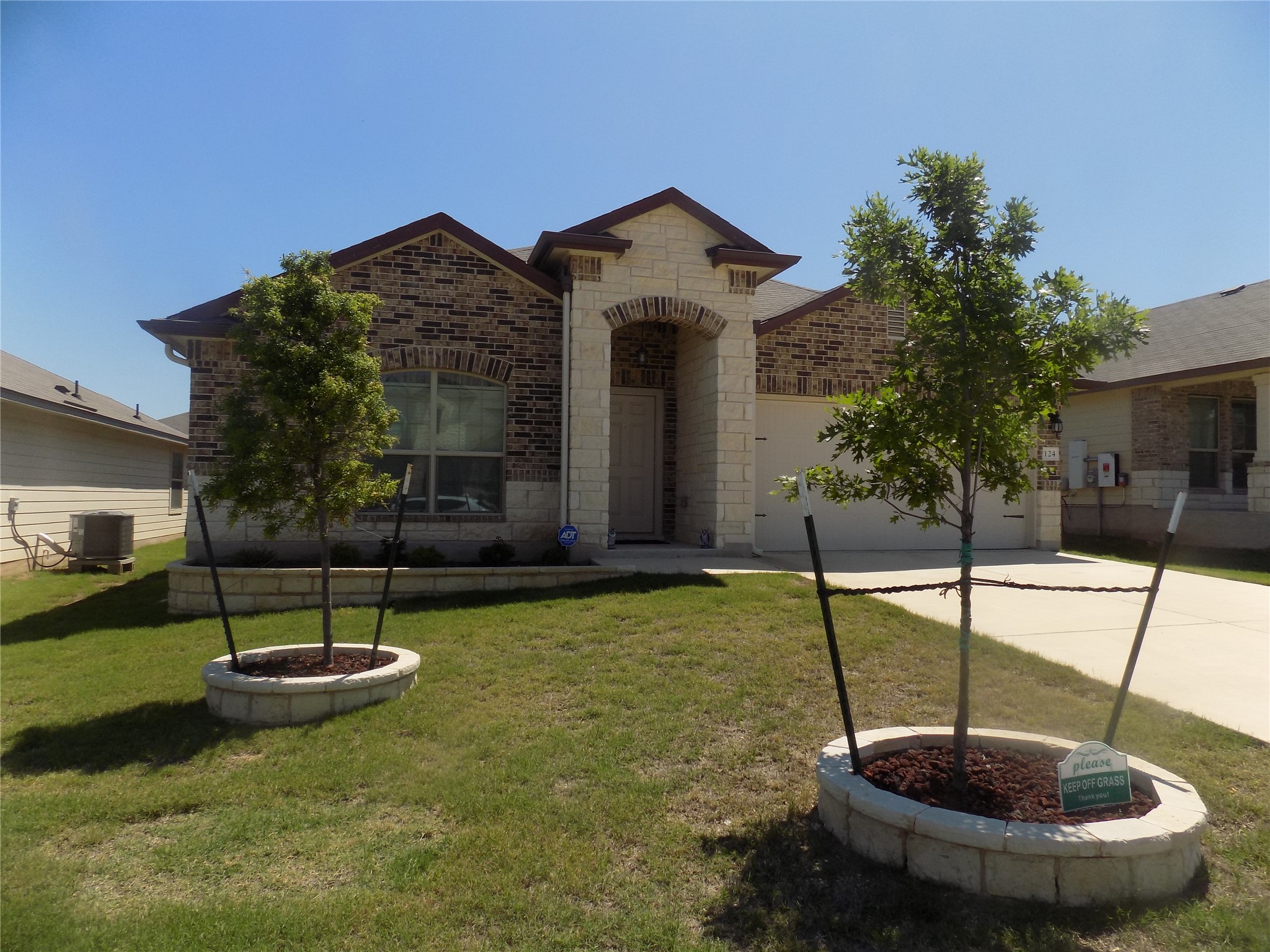 124 Rearden Boulevard Jarrell, TX 76537 - Photo 2 of 16 a view of a swimming pool with a garden