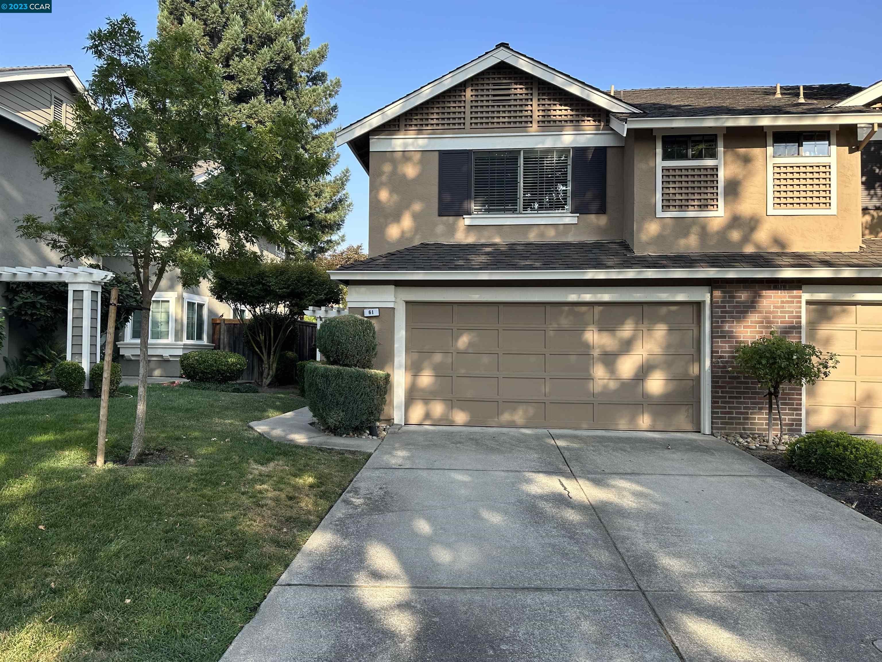 61 Rainbow Circle Danville, CA 94506 - Photo 1 of 22 a front view of a house with garden