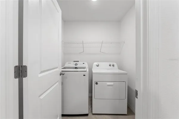 a front view of a house with a garden and yard