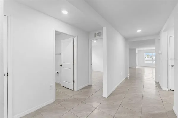 an empty room with a empty space and window