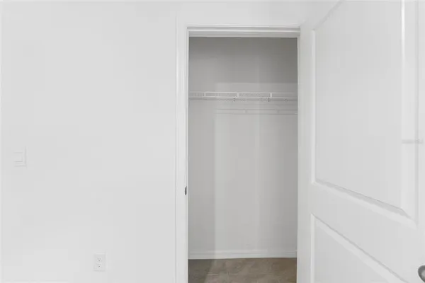 an empty room with windows and entrance