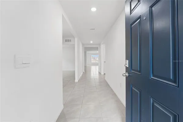 a kitchen with stainless steel appliances granite countertop a stove top oven microwave and refrigerator