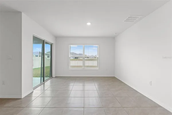 a view of a house with a yard and a porch