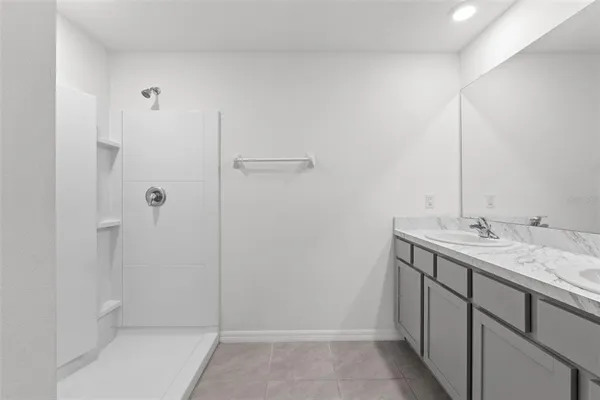 a bedroom with a bed chair and a window