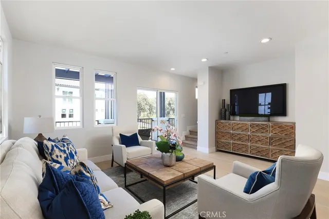a kitchen with stainless steel appliances a sink a refrigerator and a counter space