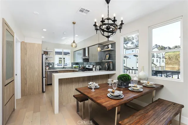 a kitchen with granite countertop a refrigerator and a sink