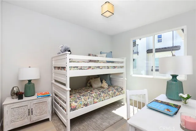 a bedroom with a bed and a potted plant