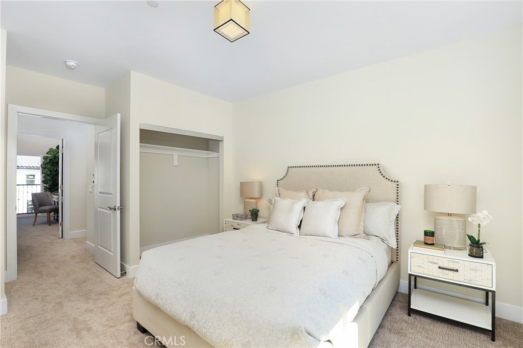 32 Spyglass Avenue Phillips Ranch, CA 91766 - Photo 23 of 63 a bedroom with a bed and a chandelier