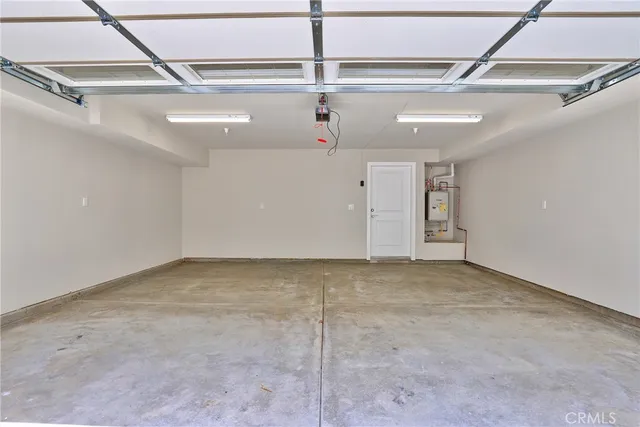 an outdoor space with patio and white umbrellas