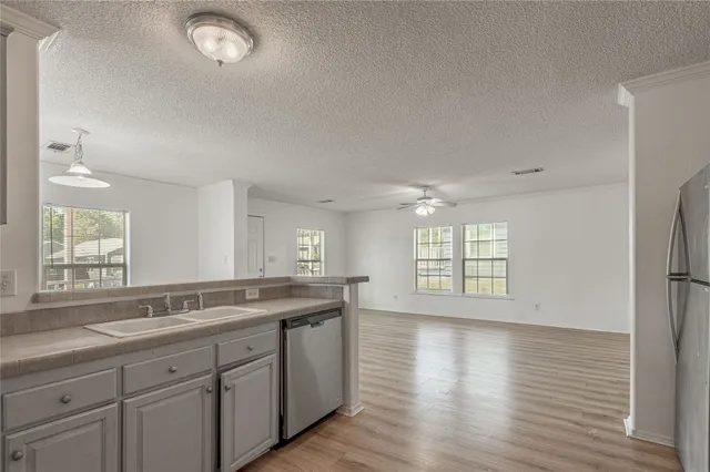 a bathroom with a sink toilet a mirror and shower