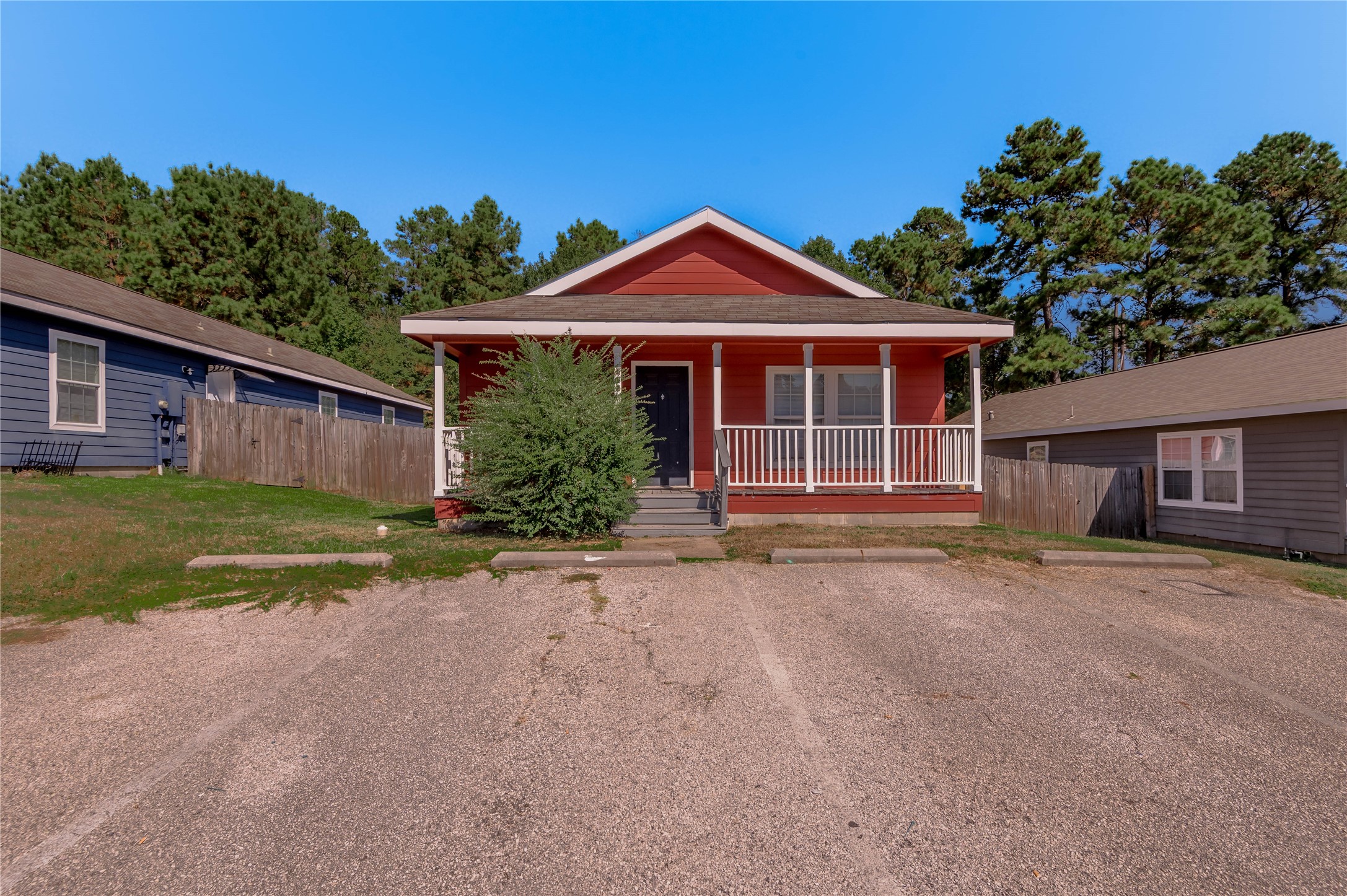 112 Varsity Circle Huntsville, TX 77340 - Photo 2 of 33 a front view of a house with a yard and garage